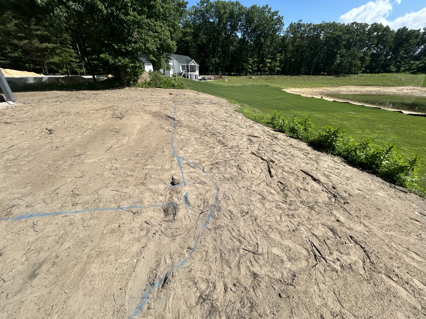 Freshly graded slope and new lawn on a landscaping project