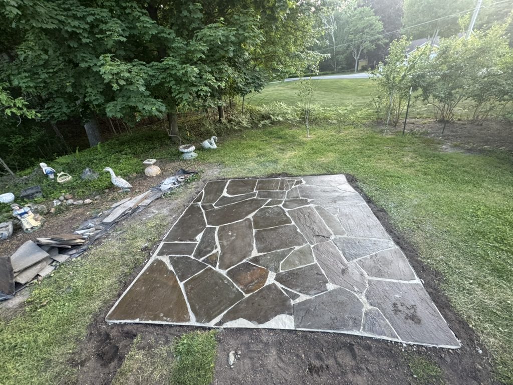 Finished natural flagstone patio installed by West Michigan Professionals